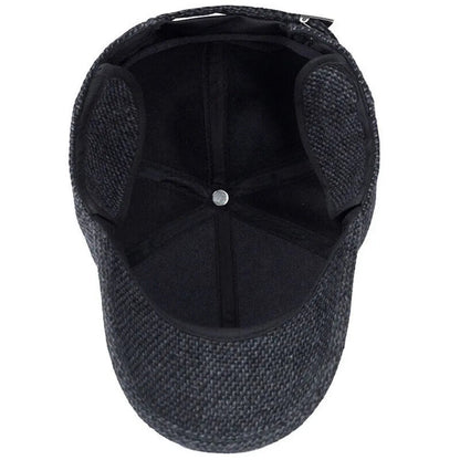 Vintermössa för män med öronskydd och justerbar snapback
